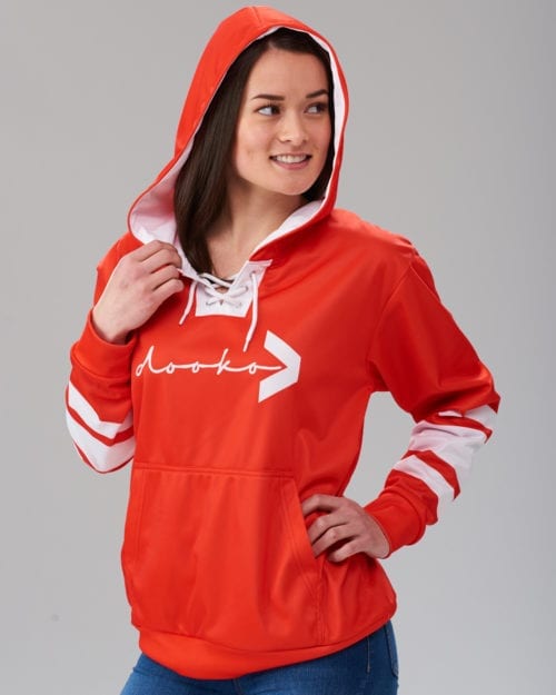 female model wearing an orange lace-up hoodie with white stripes